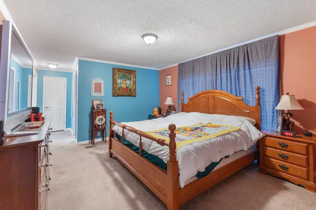 a small house with a trees in the background