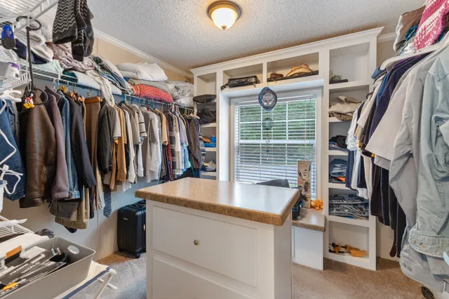a balcony with wooden floor and fence