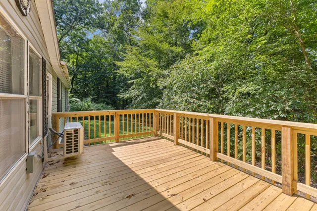 a bathroom with a sink a toilet and shower curtain