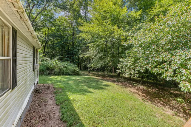 a kitchen with stainless steel appliances a refrigerator sink and cabinets
