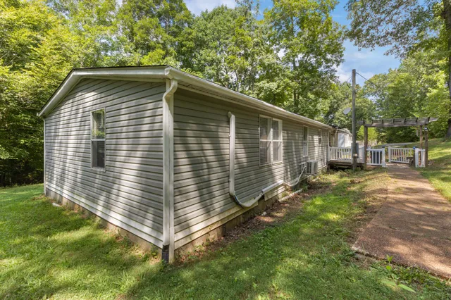 a bed room with furniture and a lamp