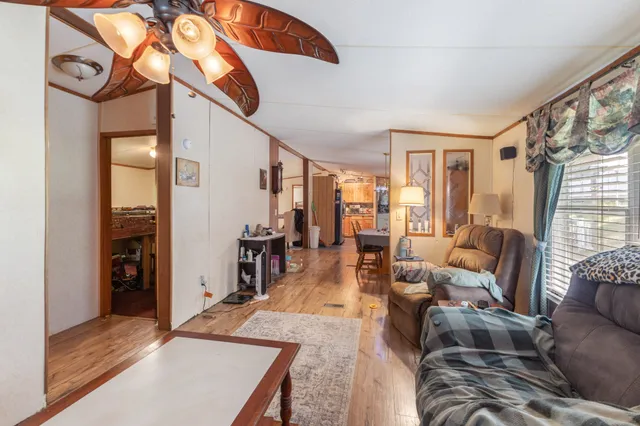 an aerial view of a house with swimming pool and garden view