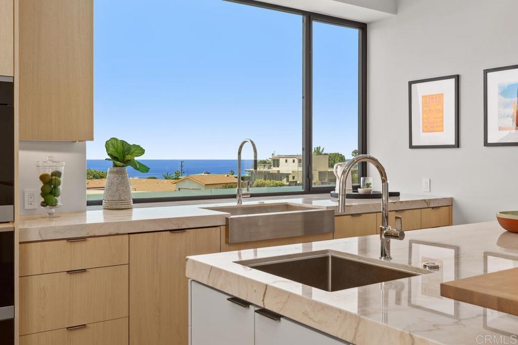 431 Marview Lane Solana Beach, CA 92075 - Photo 12 of 37 a kitchen with a sink and a cabinets