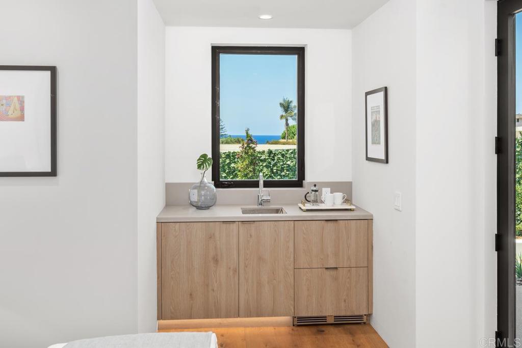 431 Marview Lane Solana Beach, CA 92075 - Photo 19 of 37 a bathroom with a granite countertop sink and a mirror