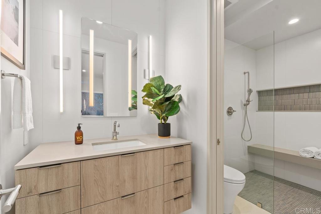 431 Marview Lane Solana Beach, CA 92075 - Photo 22 of 37 a bathroom with a sink a toilet and shower