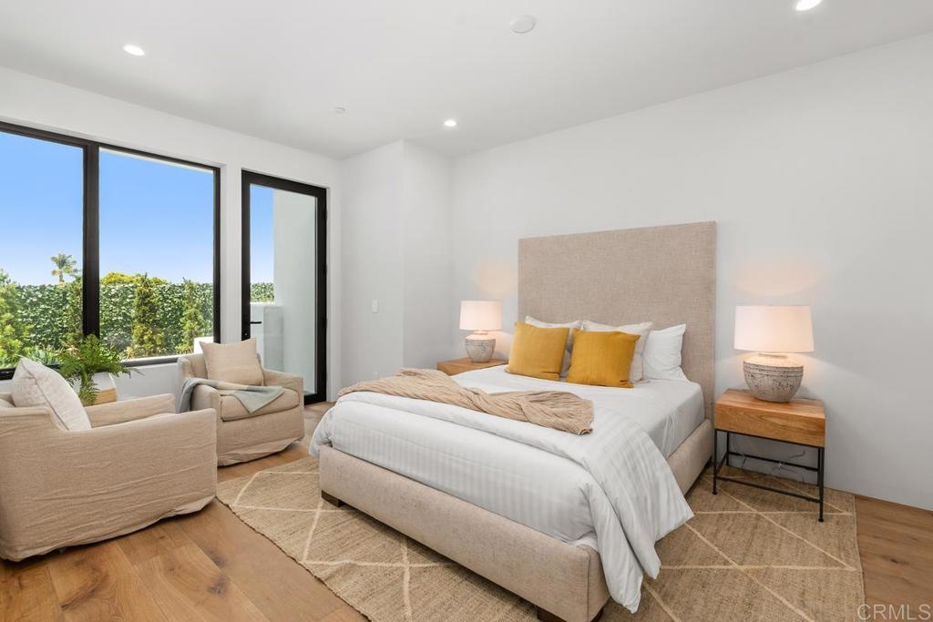 431 Marview Lane Solana Beach, CA 92075 - Photo 23 of 37 a bedroom with a bed and a large window