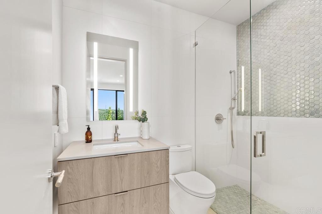 431 Marview Lane Solana Beach, CA 92075 - Photo 24 of 37 a bathroom with a granite countertop sink toilet and shower