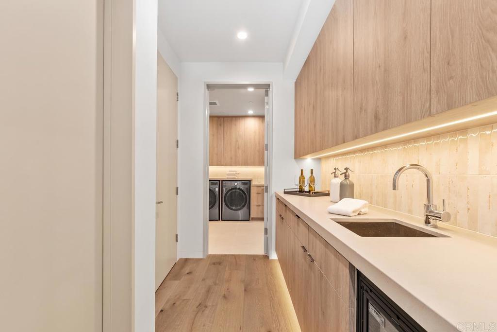 431 Marview Lane Solana Beach, CA 92075 - Photo 33 of 37 a kitchen with a sink a counter top space stainless steel appliances and cabinets