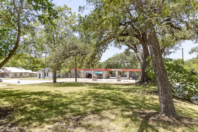 a house with swimming pool in front of it