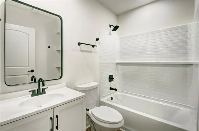 a bathroom with a sink a toilet and a bathtub