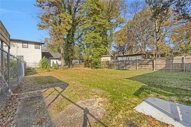 a view of yard with swimming pool