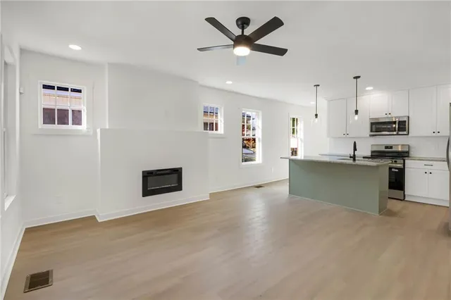 a view of a kitchen with a sink and a window