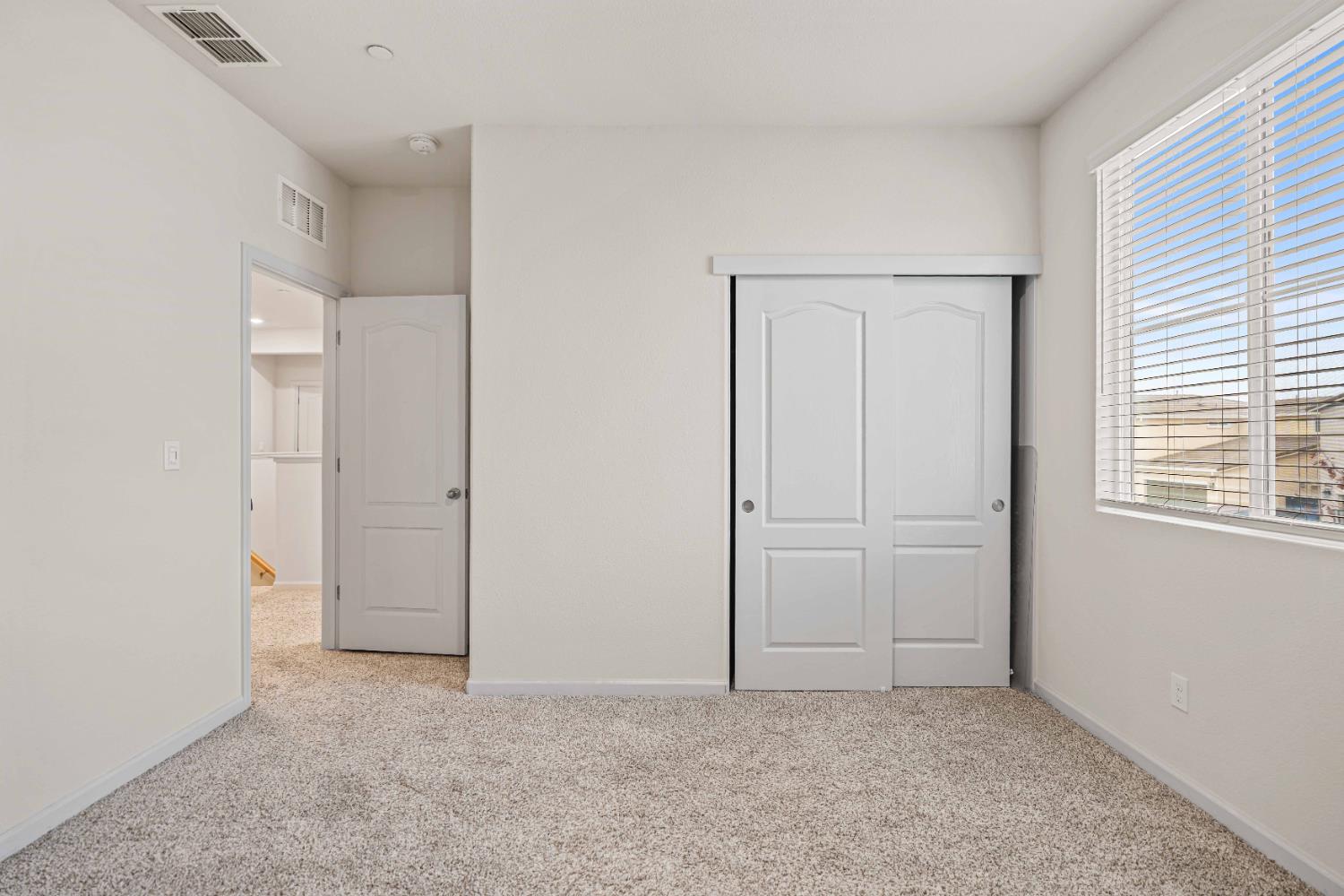 3095 Tower Street Manteca, CA 95337 - Photo 17 of 40 an empty room with windows and closet