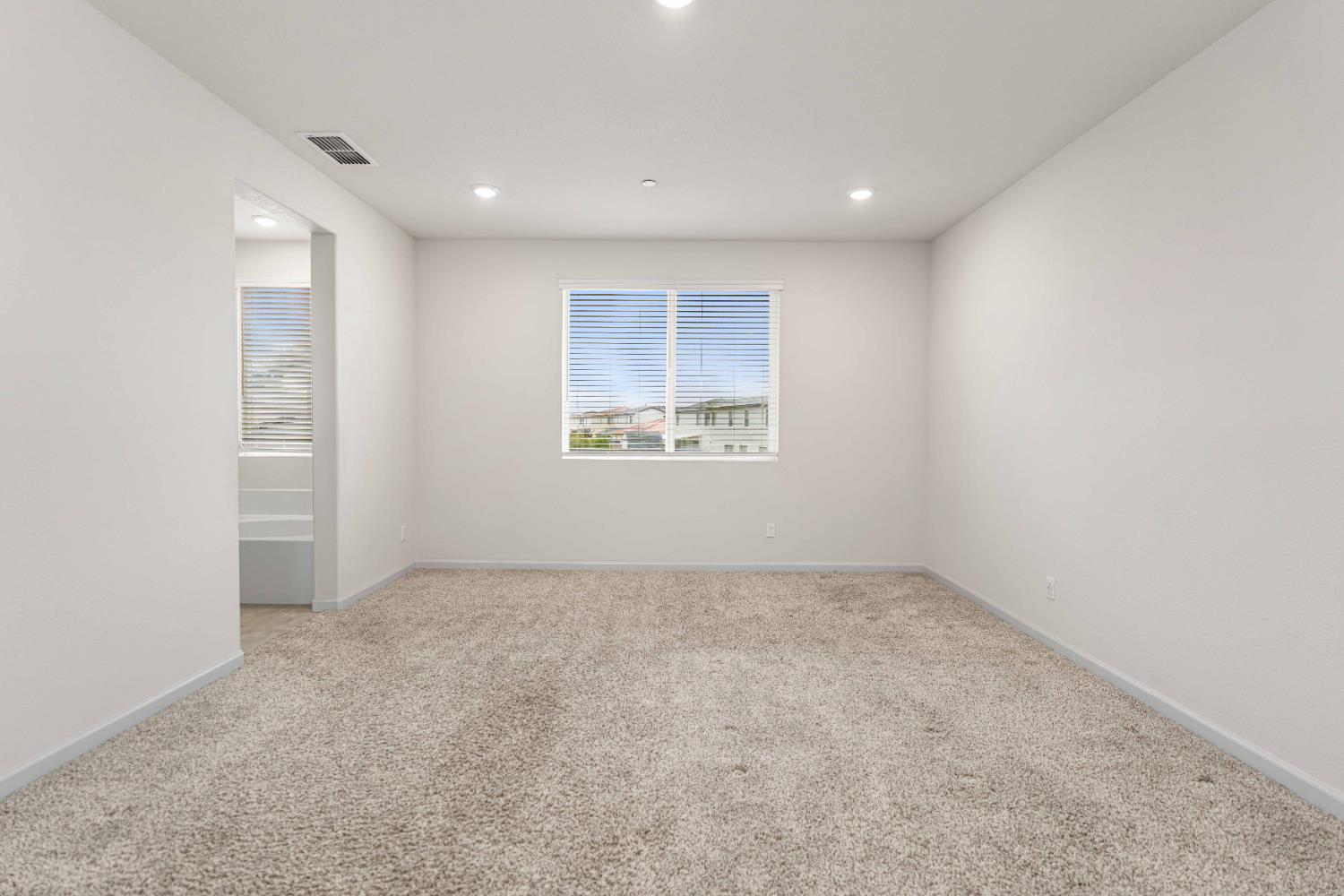 3095 Tower Street Manteca, CA 95337 - Photo 24 of 40 an empty room with a windows and closet