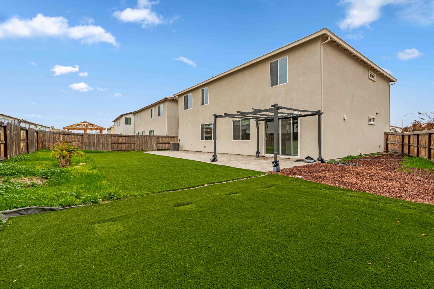 3095 Tower Street Manteca, CA 95337 - Photo 30 of 40 a view of an house with backyard porch and garden