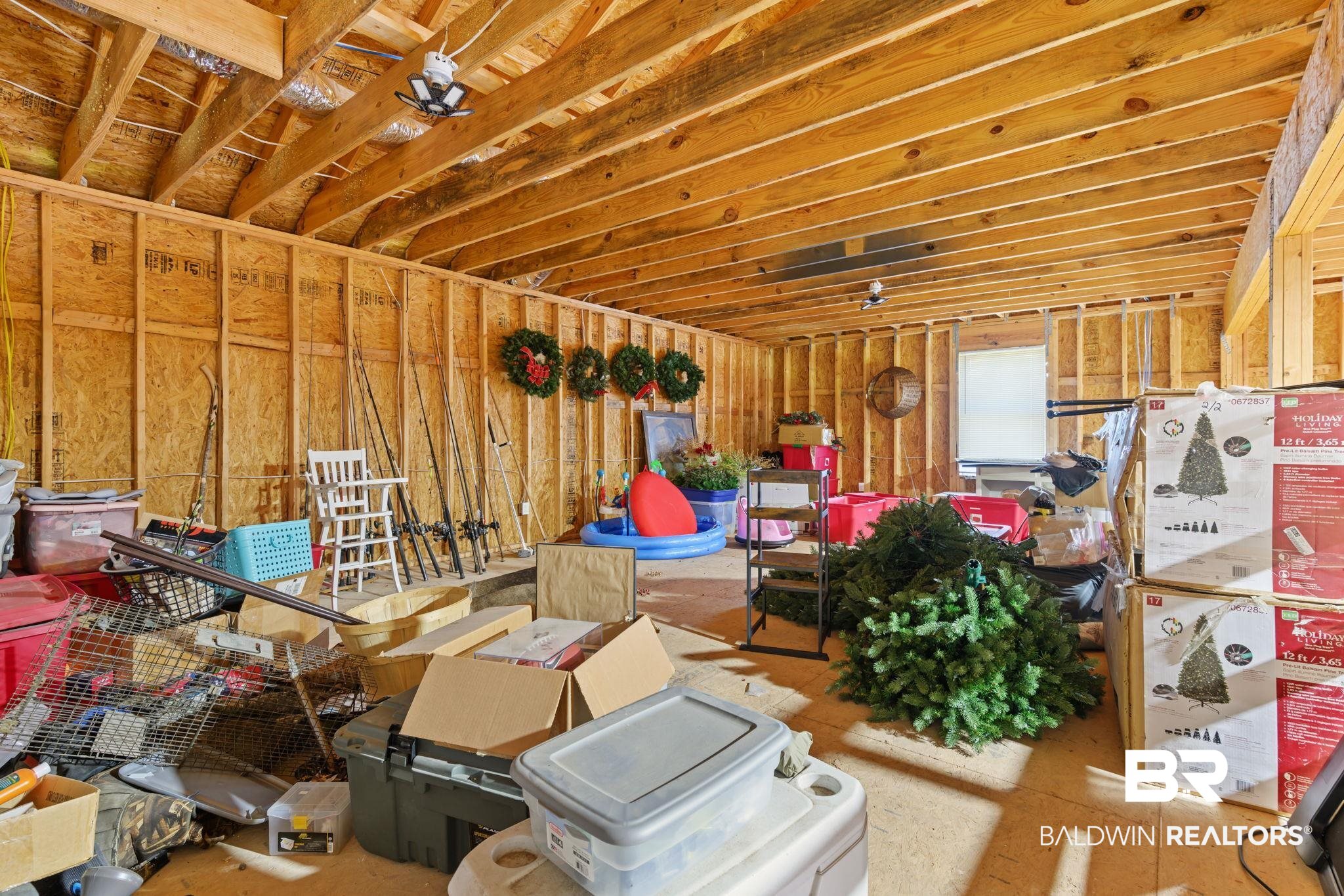 11025 Creax Road Axis, AL 36505 - Photo 36 of 45 Unfinished interior space featuring exposed wood framing, open joists, and a single window
