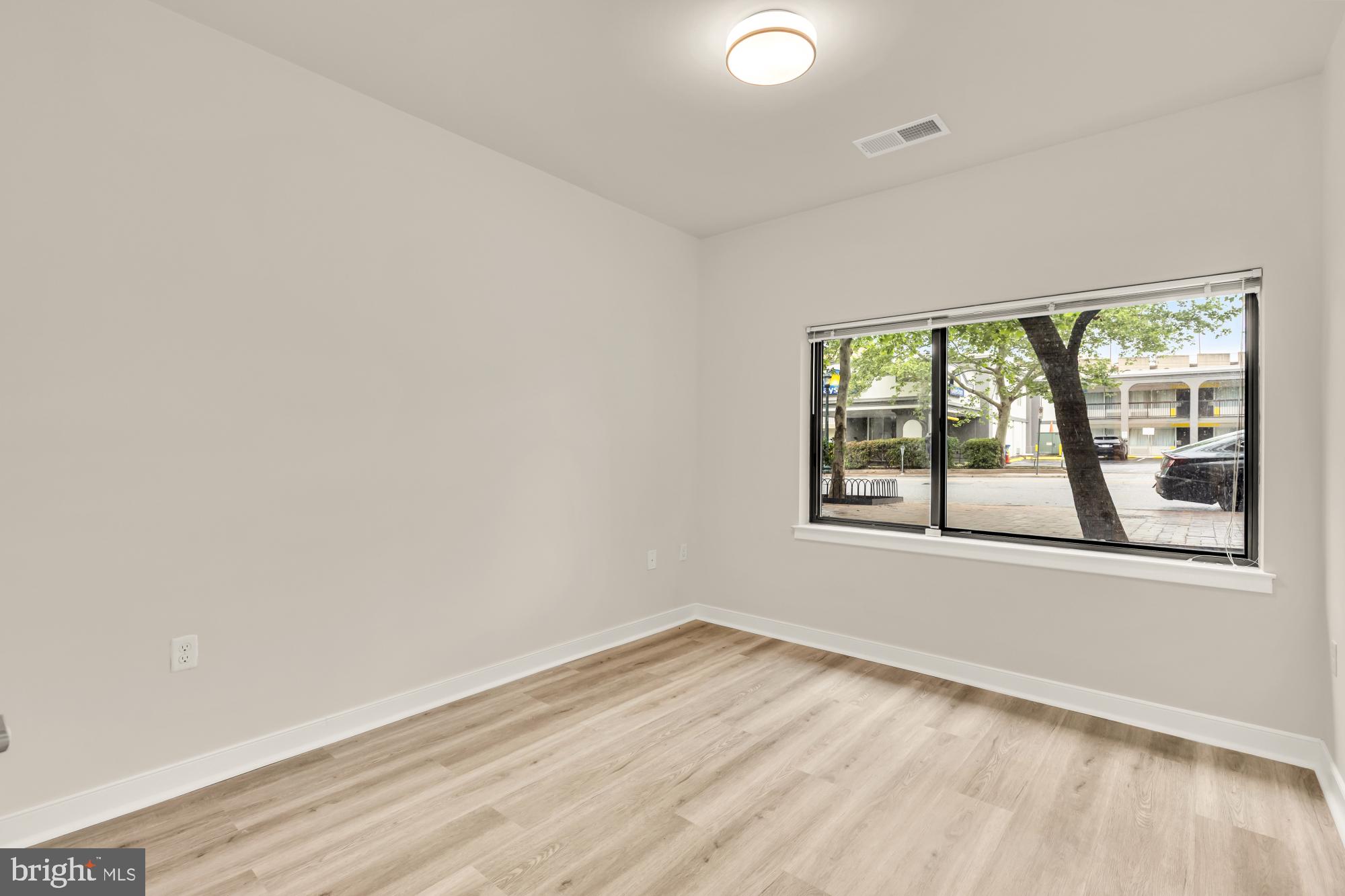 8005 13th Street, Unit 104 Silver Spring, MD 20910 - Photo 24 of 34 an empty room with a window