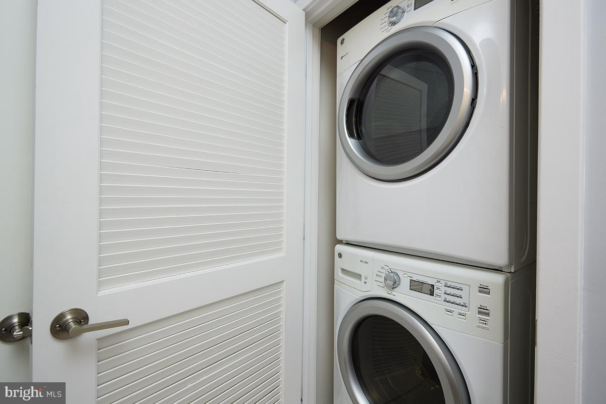 8005 13th Street, Unit 104 Silver Spring, MD 20910 - Photo 27 of 34 a close view of a utility room with dryer and washer