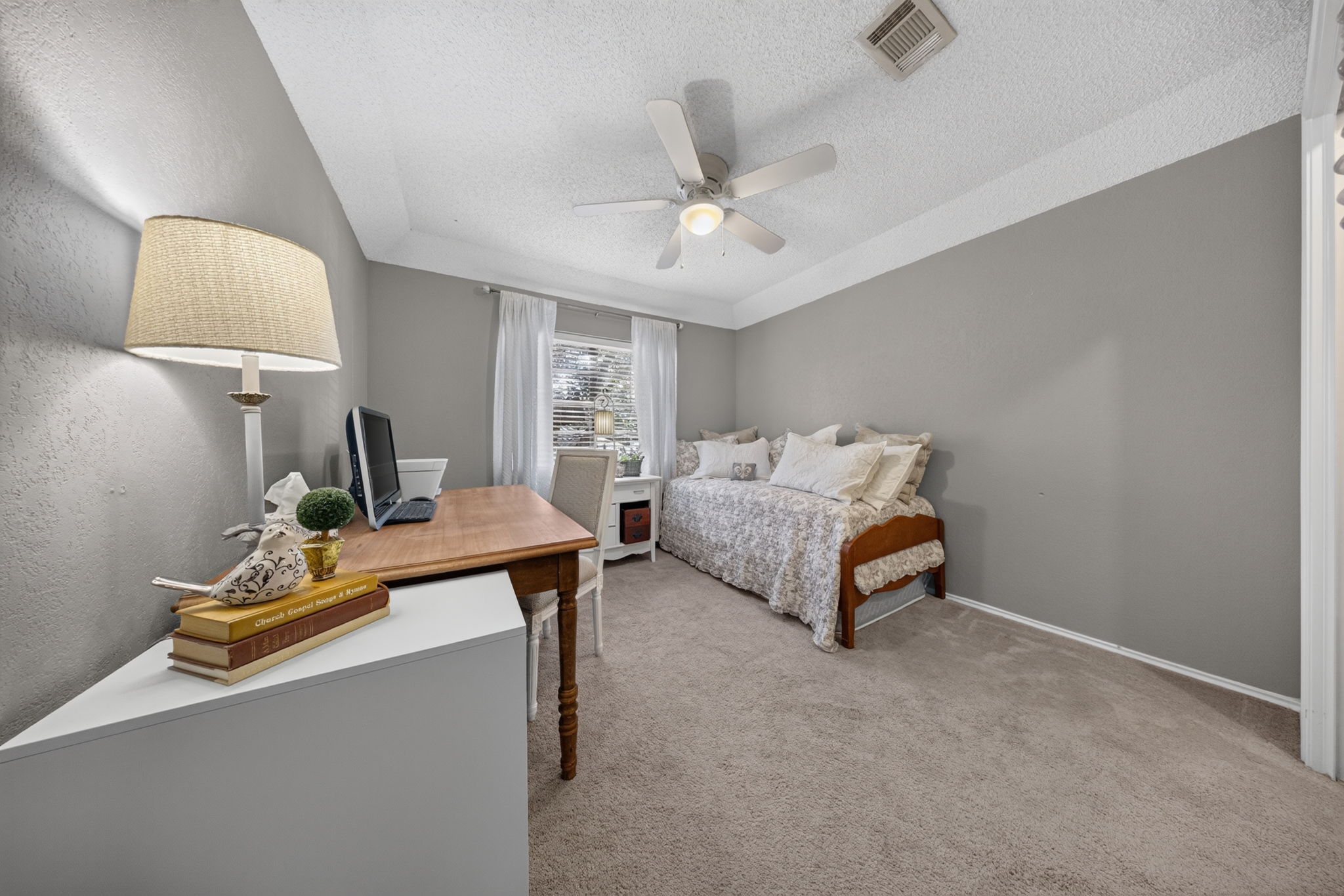 806 Mountain Ridge Drive Leander, TX 78641 - Photo 15 of 40 Plush carpeting anchors this versatile room boasting a tiered tray ceiling.