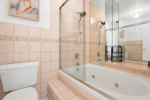 a bathroom with a bathtub and a shower