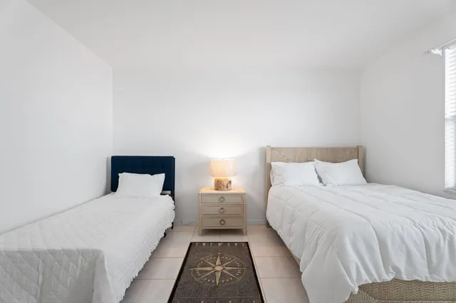 a bed room with double bed and a night stand