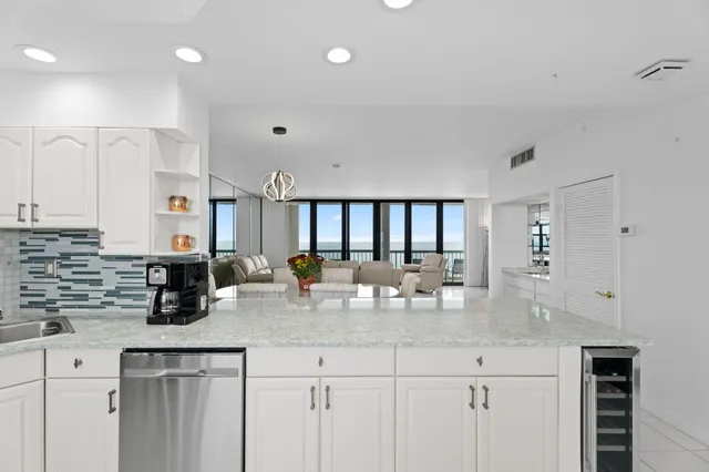 a kitchen with counter top space cabinets and stainless steel appliances