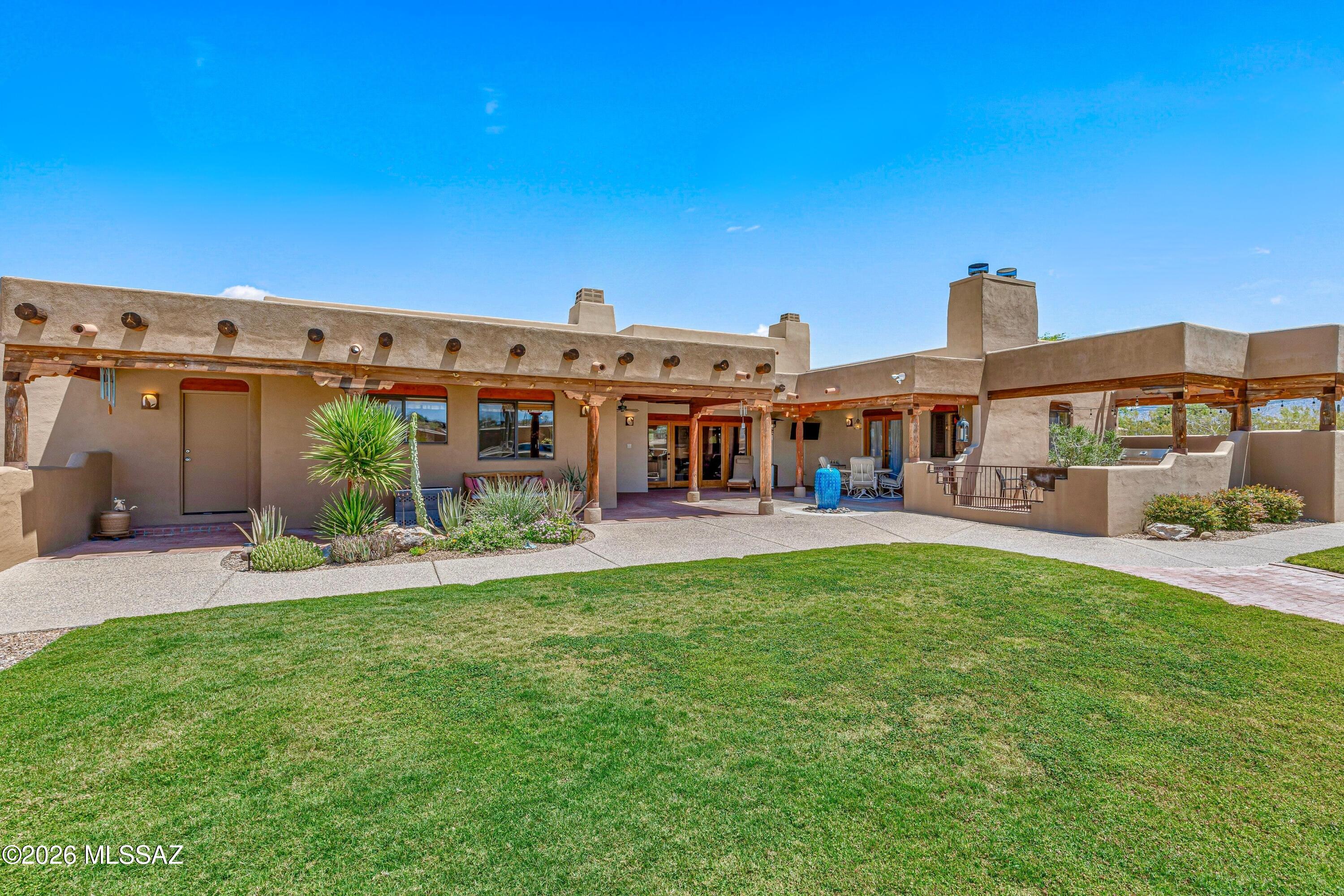11160 East Golf Links Road Tucson, AZ 85730 - Photo 27 of 51 The entire year of the house has large covered porches.