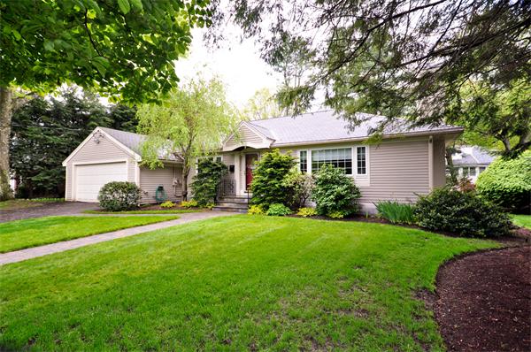 12 Ferncroft Road Newton, MA 02468 - Photo 1 of 24 a front view of a house with a garden and yard