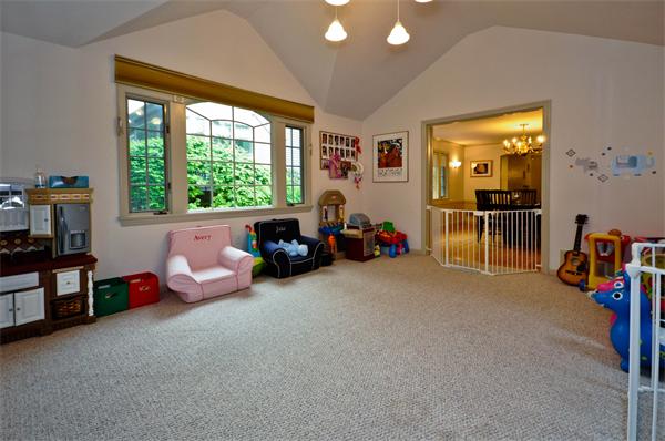 12 Ferncroft Road Newton, MA 02468 - Photo 11 of 24 a living room with furniture a flat screen tv and a large window