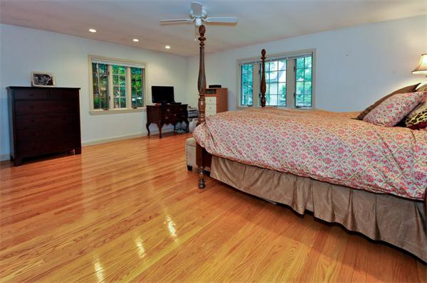 12 Ferncroft Road Newton, MA 02468 - Photo 15 of 24 a bedroom with a bed and wooden floor