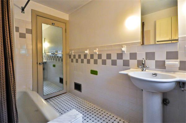12 Ferncroft Road Newton, MA 02468 - Photo 18 of 24 a bathroom with a sink a toilet and shower