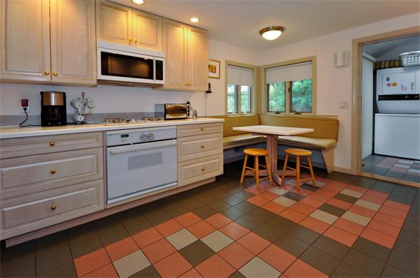 12 Ferncroft Road Newton, MA 02468 - Photo 7 of 24 a kitchen with stainless steel appliances kitchen island granite countertop a sink and cabinets