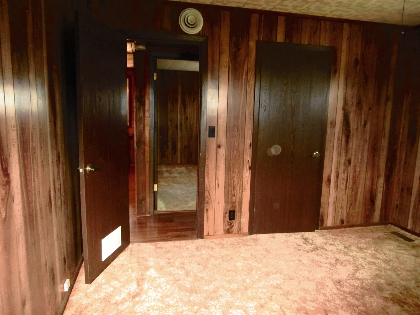 1713 Nauman Road Amboy, IL 61310 - Photo 17 of 38 a view of a hallway with wooden walls