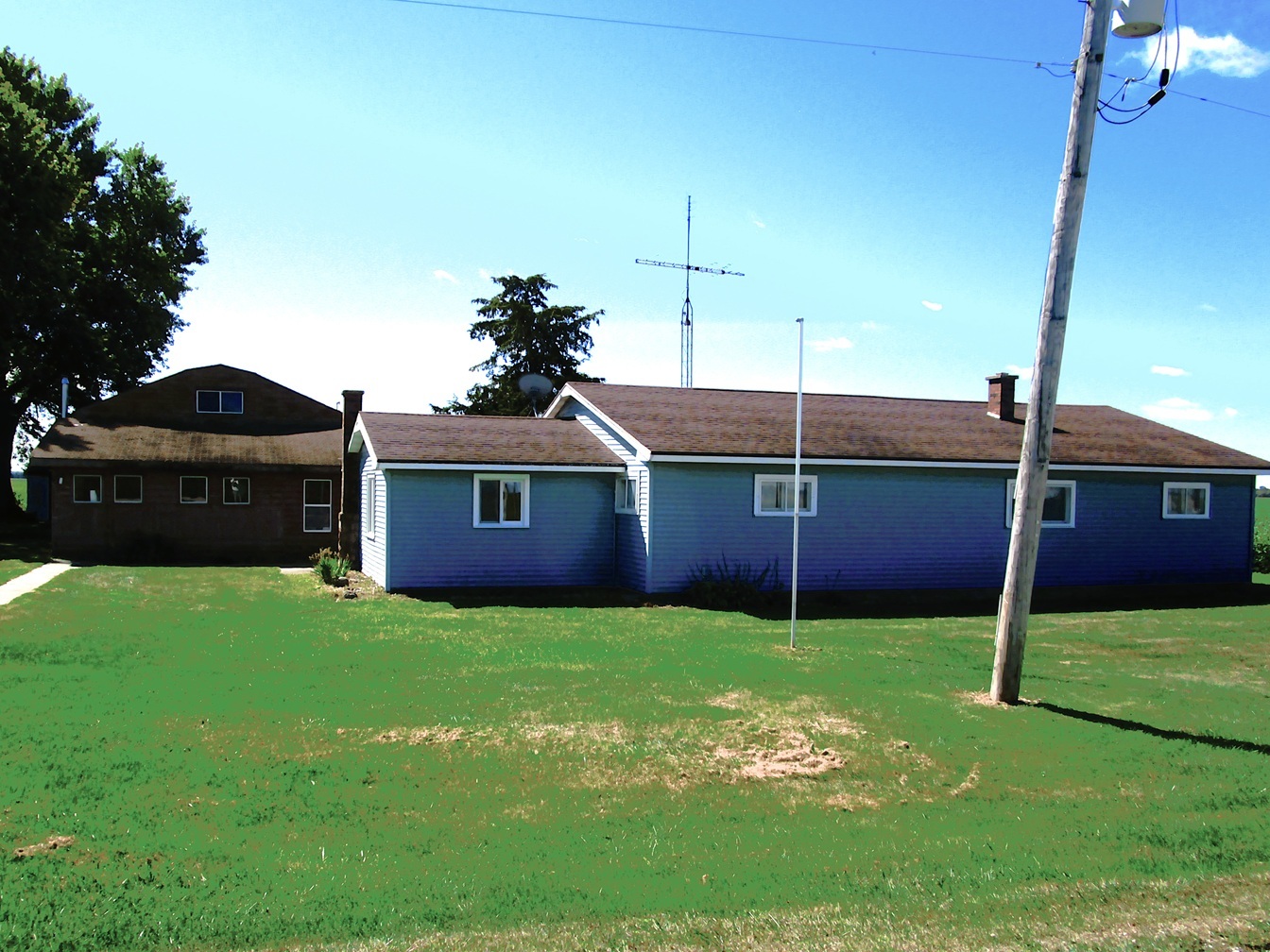 1713 Nauman Road Amboy, IL 61310 - Photo 2 of 38 a view of a house with a yard