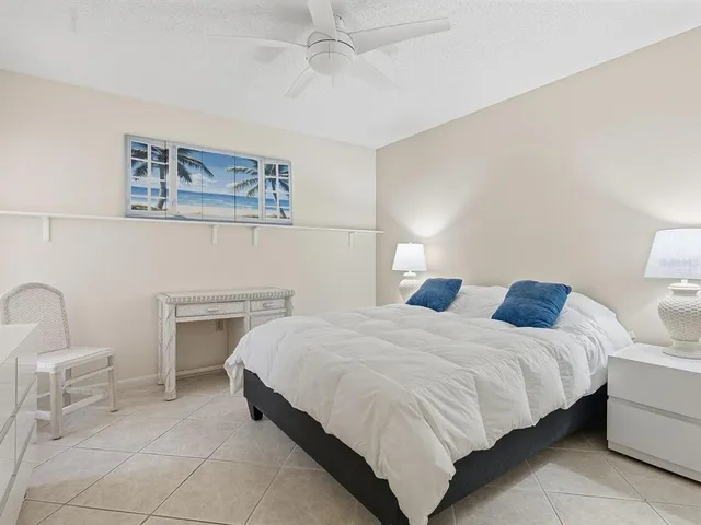 a bedroom with a bed and a table