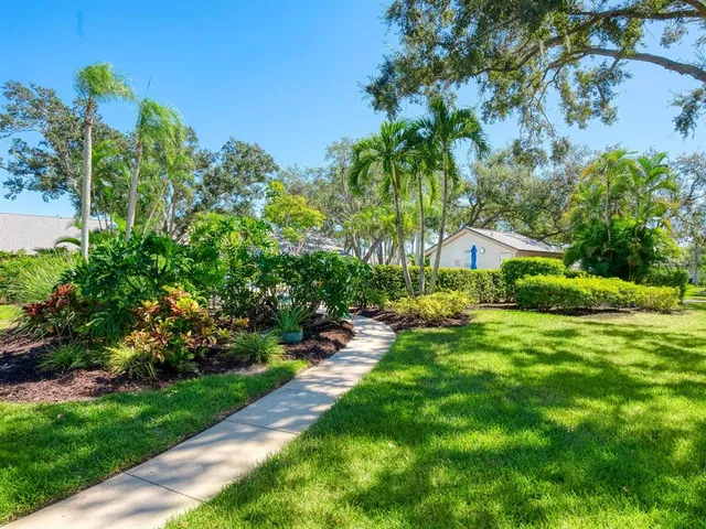a view of a garden with a house