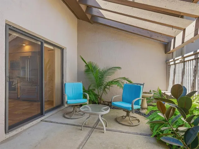 a living room with patio furniture