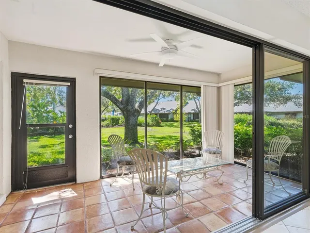 a view of a room with balcony and furniture