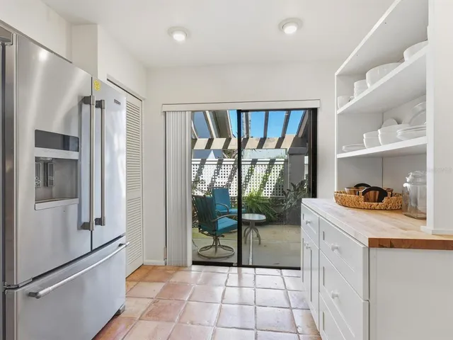 a kitchen with stainless steel appliances a stove a refrigerator and a refrigerator