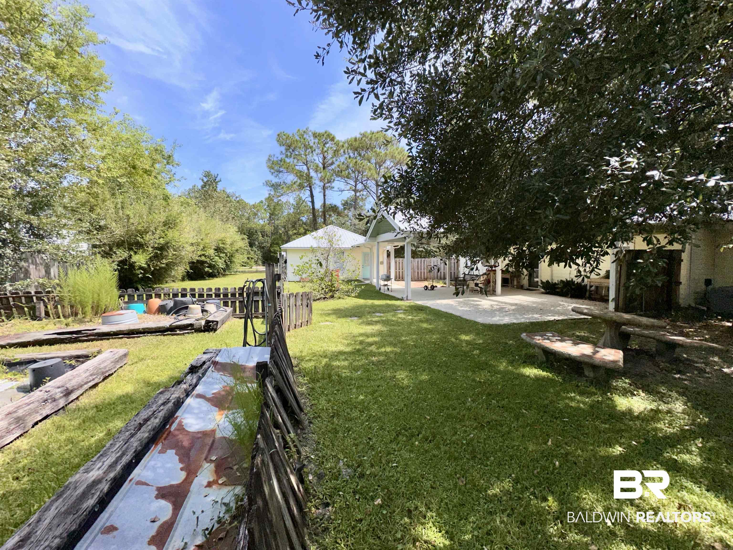 9101 Coronada Road Elberta, AL 36530 - Photo 20 of 27 View of yard with a patio area and view of wooded area