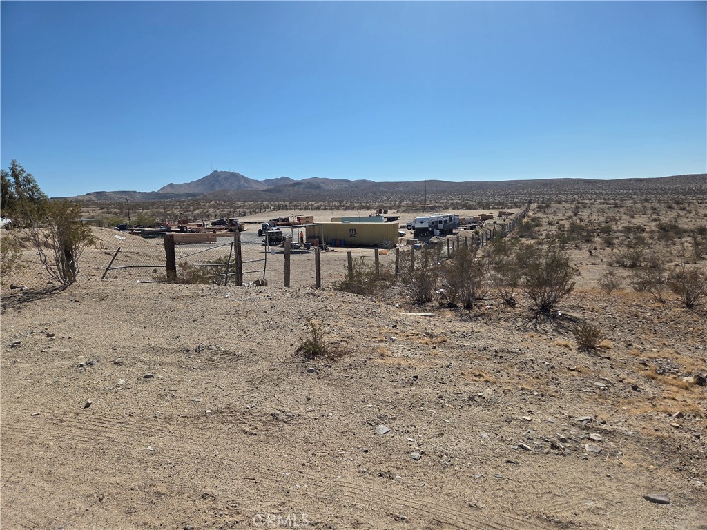 15411 Rattlesnake Gulch Oro Grande, CA 92368 - Photo 2 of 9 a view of a lake with mountain
