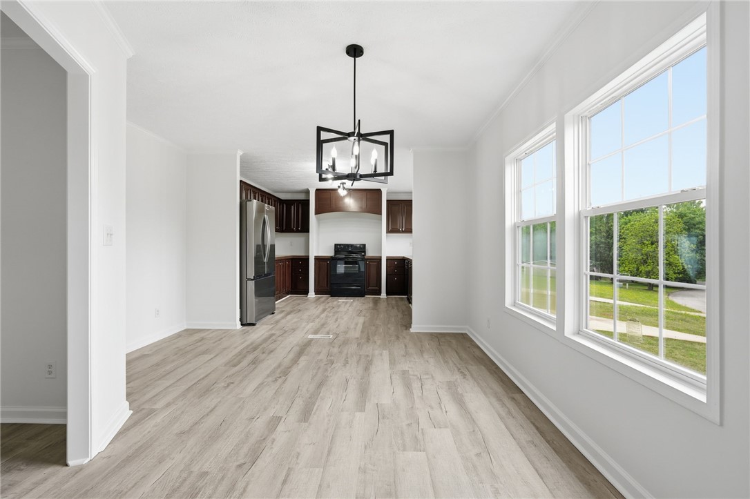 112 Sir Francis Drake Way Liberty, SC 29657 - Photo 29 of 42 This bright interior features wood flooring, a functional kitchen, and large windows with serene views.