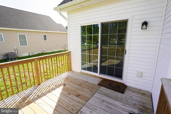 a view of a balcony with wooden floor