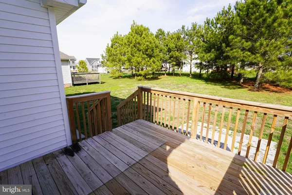 a view of balcony with wooden floor and outdoor seating