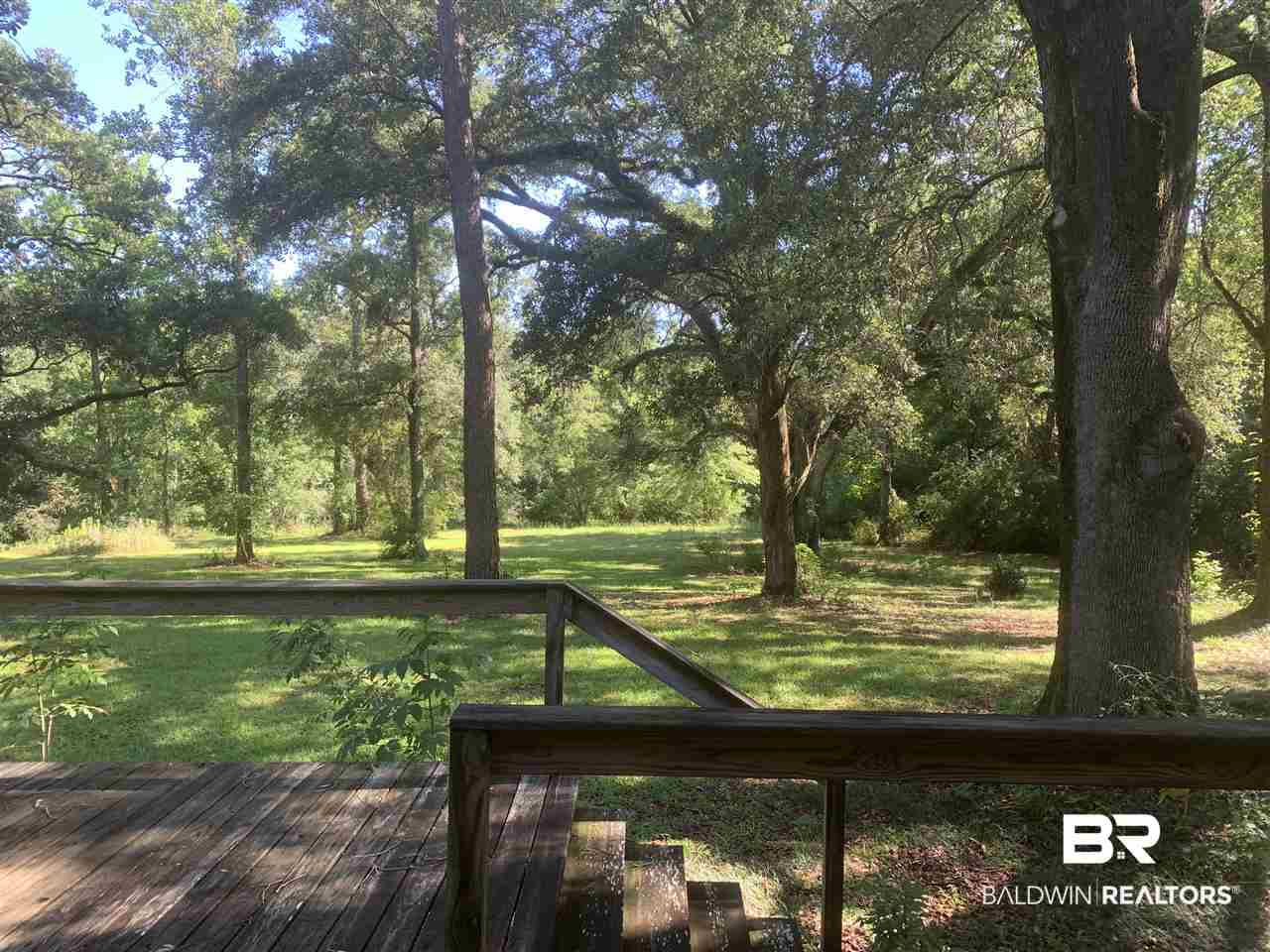 17071 County Road 52 Silverhill, AL 36576 - Photo 20 of 44 Beautiful view of the back yard & trees from room.