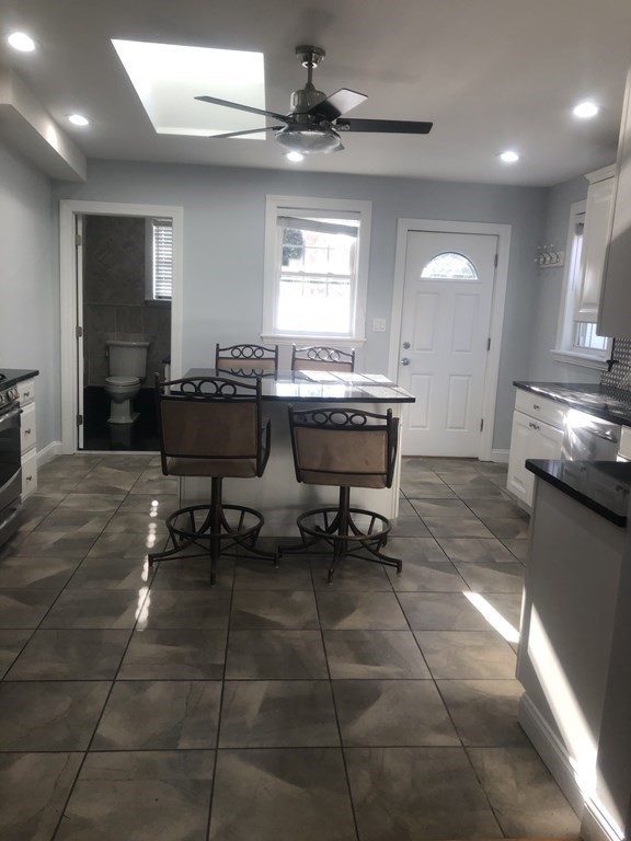 10-12 Tanglewood Road Boston, MA 02126 - Photo 12 of 17 a workspace with furniture and window