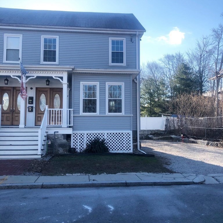 10-12 Tanglewood Road Boston, MA 02126 - Photo 2 of 17 a front view of a house