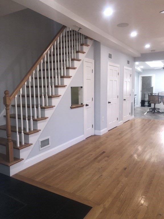 10-12 Tanglewood Road Boston, MA 02126 - Photo 5 of 17 a view of entryway and hall with wooden floor