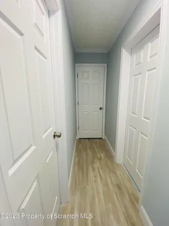 a view of street with parked cars