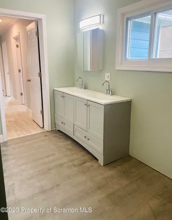 a bathroom with a sink a toilet and bathtub